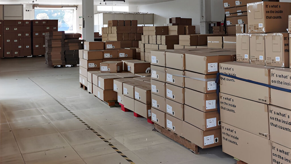 Finished custom straw hats packed in branded export cartons stacked on a pallet ready for sea freight